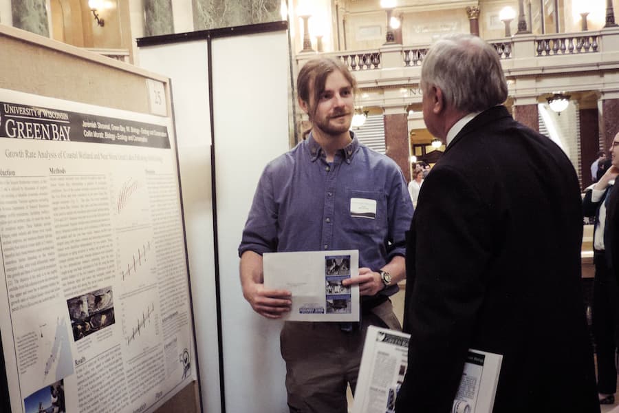 Student presents research project at capitol building
