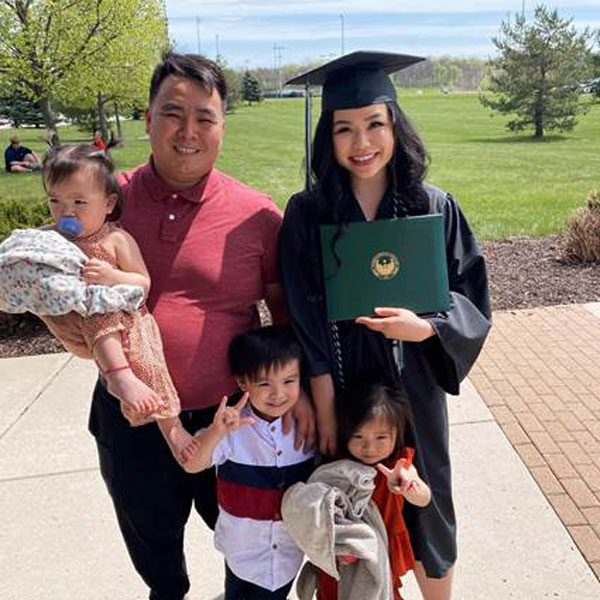 Gao Hmong Xiong poses with family at Graduation