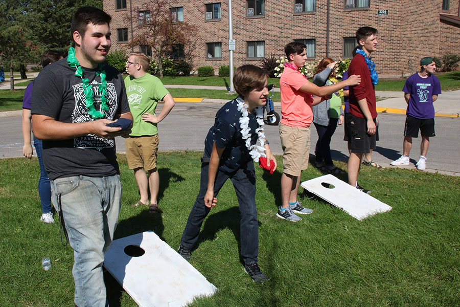 Students playing bean bag toss