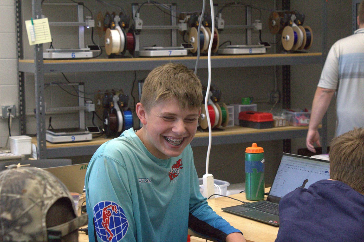 Camper laughing at other campers joke