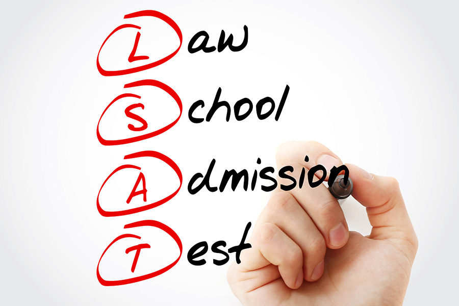 Law School Admission Test written out on clear board