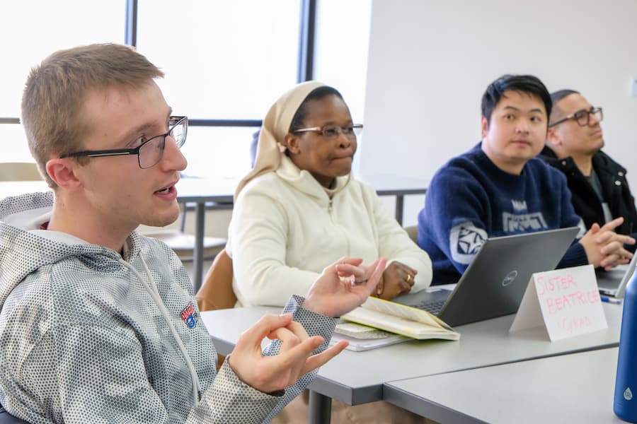 Student discussion in MS Management classroom