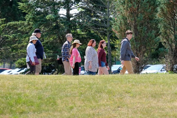 Admissions counselor Vicki Villarreal walks a family on a tour.