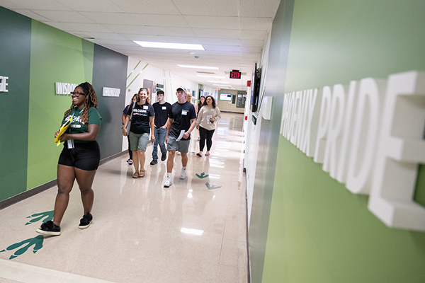 Student Aisa Rogers gives a tour to first-year students.