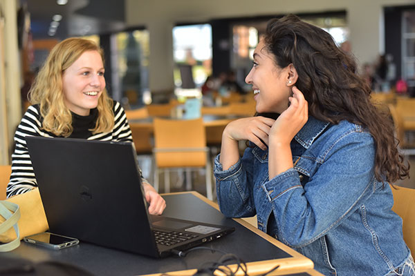 A biology professor works with a student on the UWGB Marinette Campus.