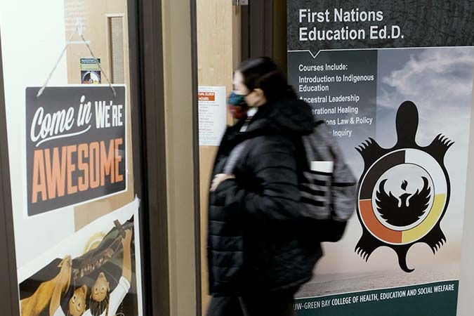 Student walking in to First Nations Education center