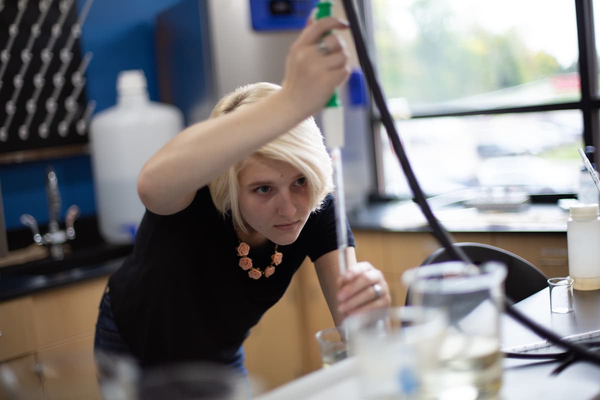 UWGB Student with lab equipment