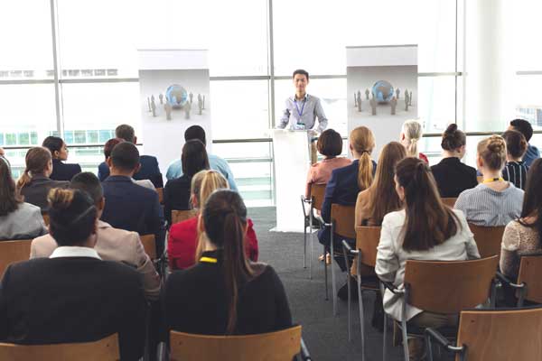 Student gives speech during business week