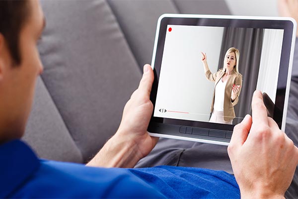 Student listening to online lecture