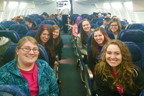 Study abroad students on a plane