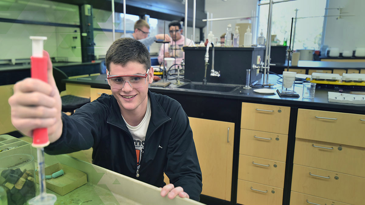 UWGB Student with lab equipment