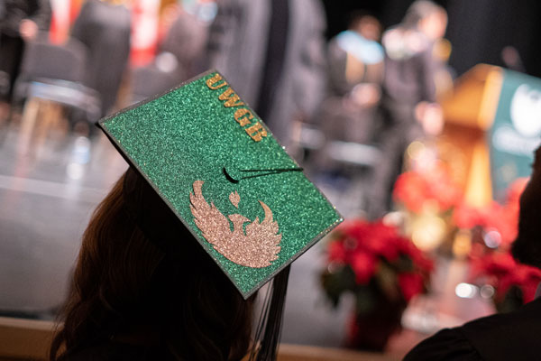 Graduation cap with UW-Green Bay Phoenix wings