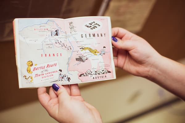 Hands holding old passport