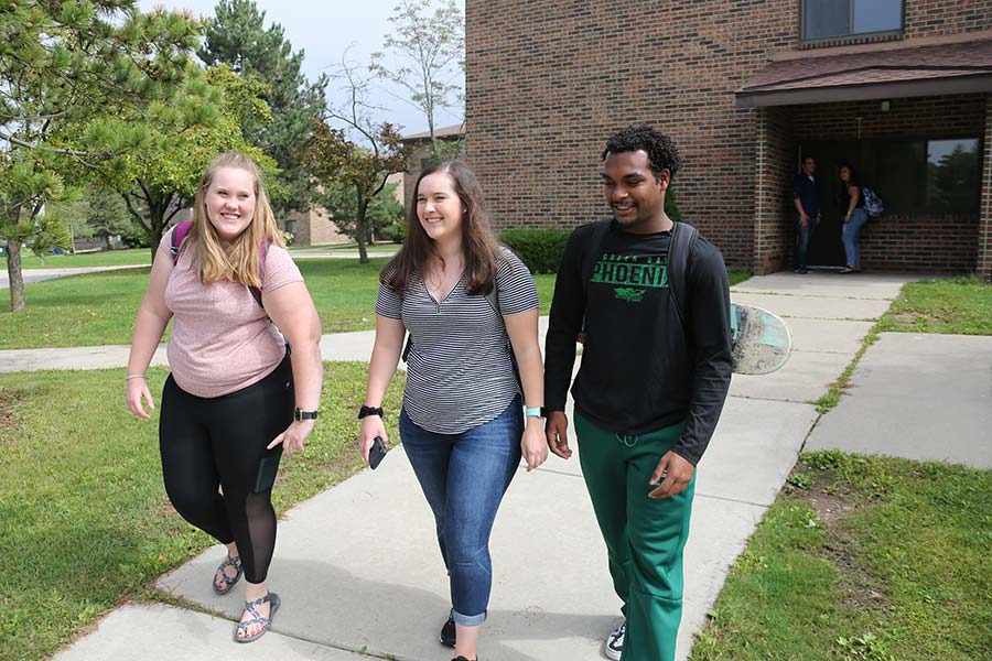 Students walking out of a residence hall