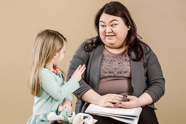 UWGB Social Work student Phanhia Yang practicing mock child counseling session at UW-Green Bay