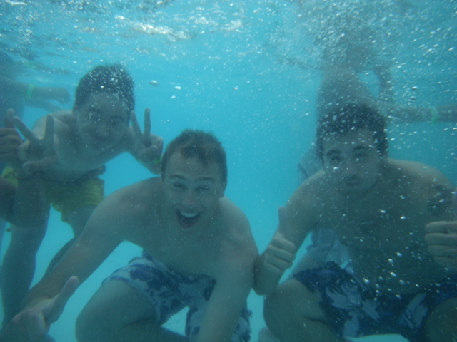 Students underwater looking at the camera