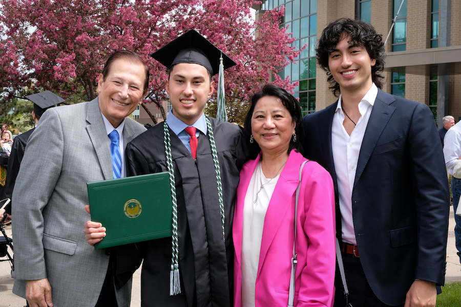 UWGB Graduate with his family