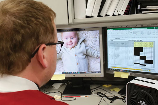 man looking at computer screen organizational leadership concept