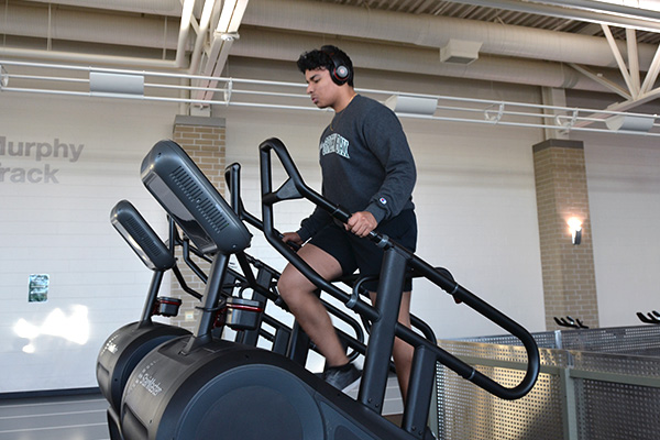 student using the stair climber machine in the uwgb fitness center