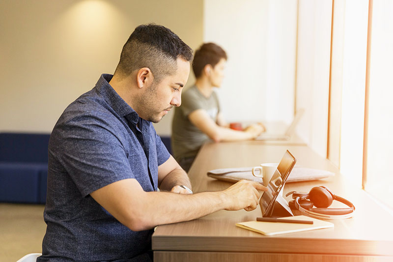 Man studying at counter