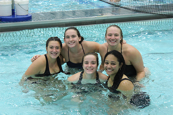 Students enjoying open swim in the poool