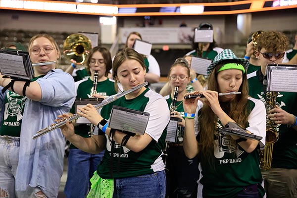 Group of students playing instruments at a game