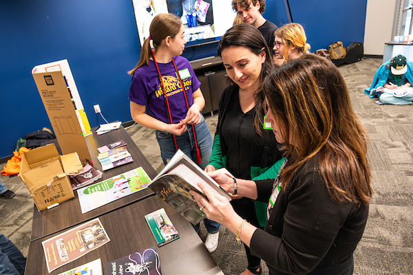Students looking at recent UW-Green Bay student publications