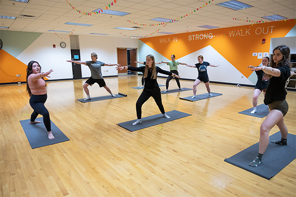 Yoga class in the uwgb group exercise studio