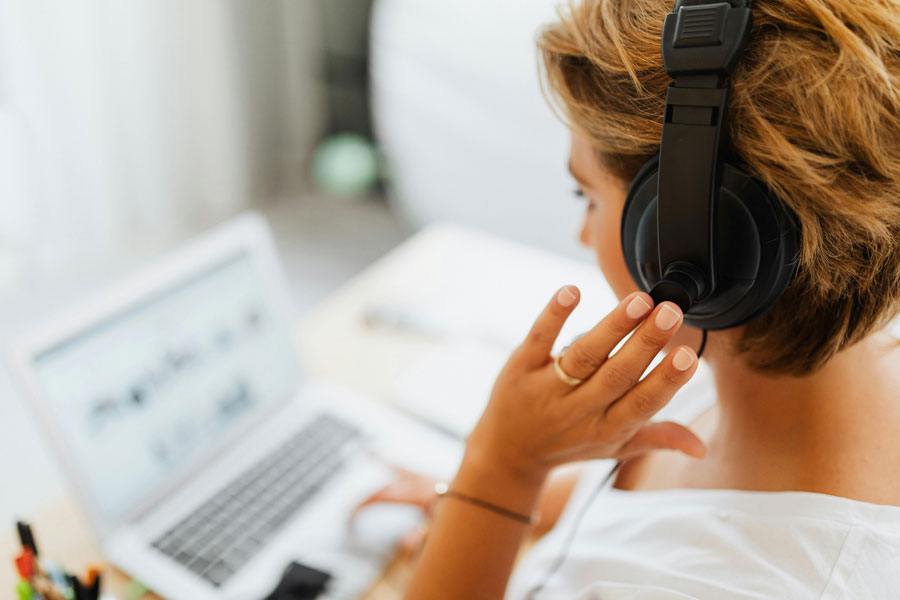 Person wearing headphones while taking crisis calls