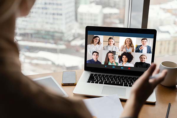 back view of woman during virtual meeting