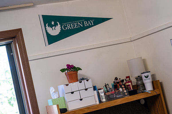 UW Green Bay pennant on dorm wall