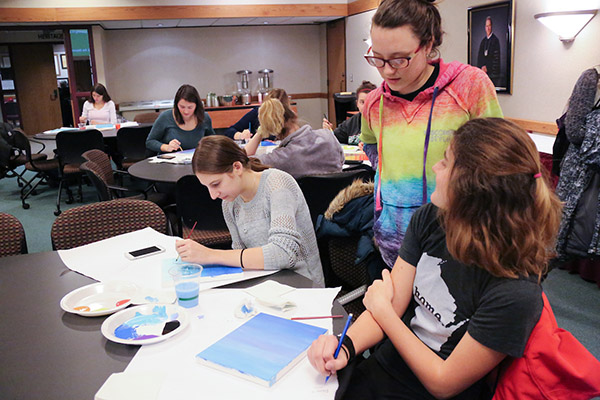 People painting at art fest