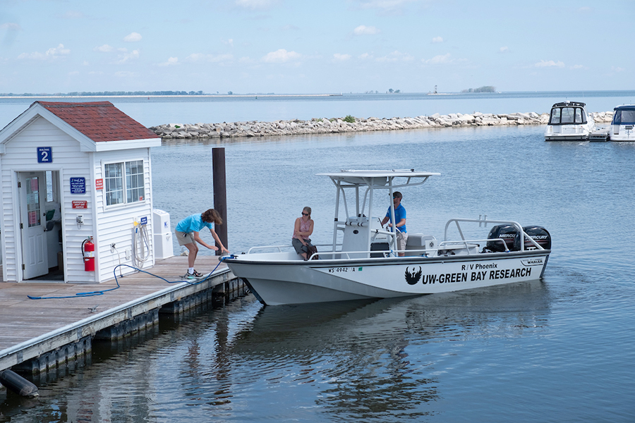 Research boat docking at pier