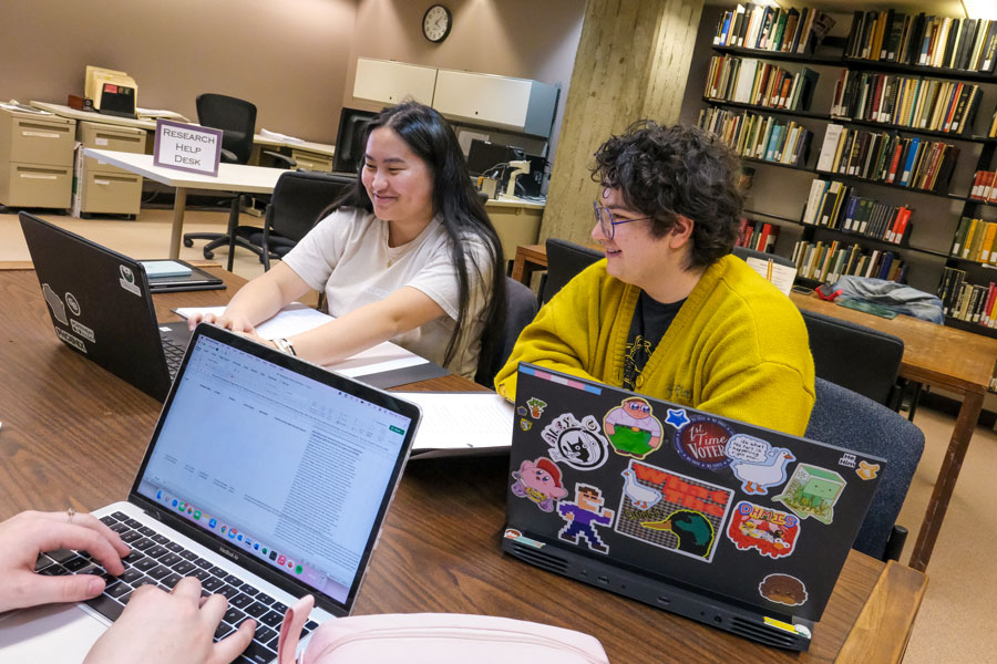 Students in library on laptops