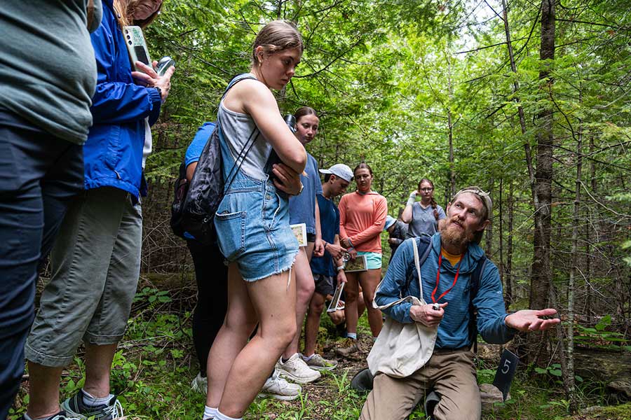 Freshwater Scholars learn in a forested area with a mentor.