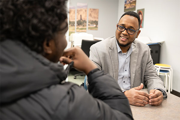 Said Hassan, UWGB Applied Leadership student at work at COSMA nonprofit.