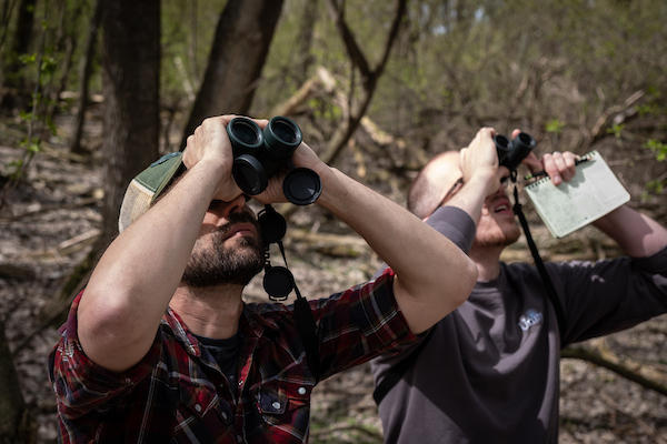 Students bird watching with binoculars