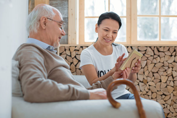 Caretaker working with senior citizen