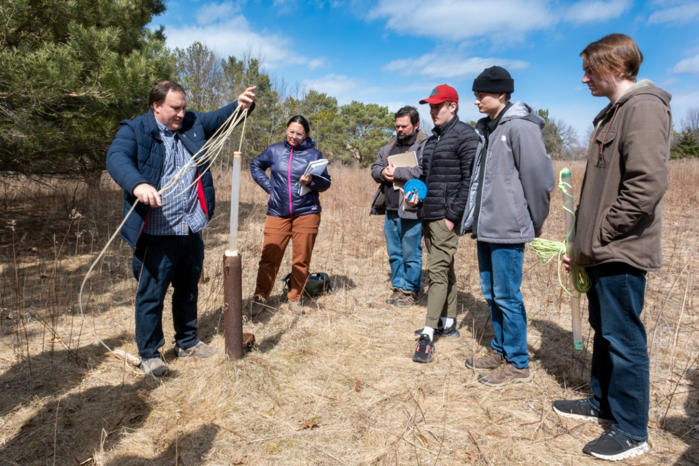 John Luczaj showing students how to perform test on well