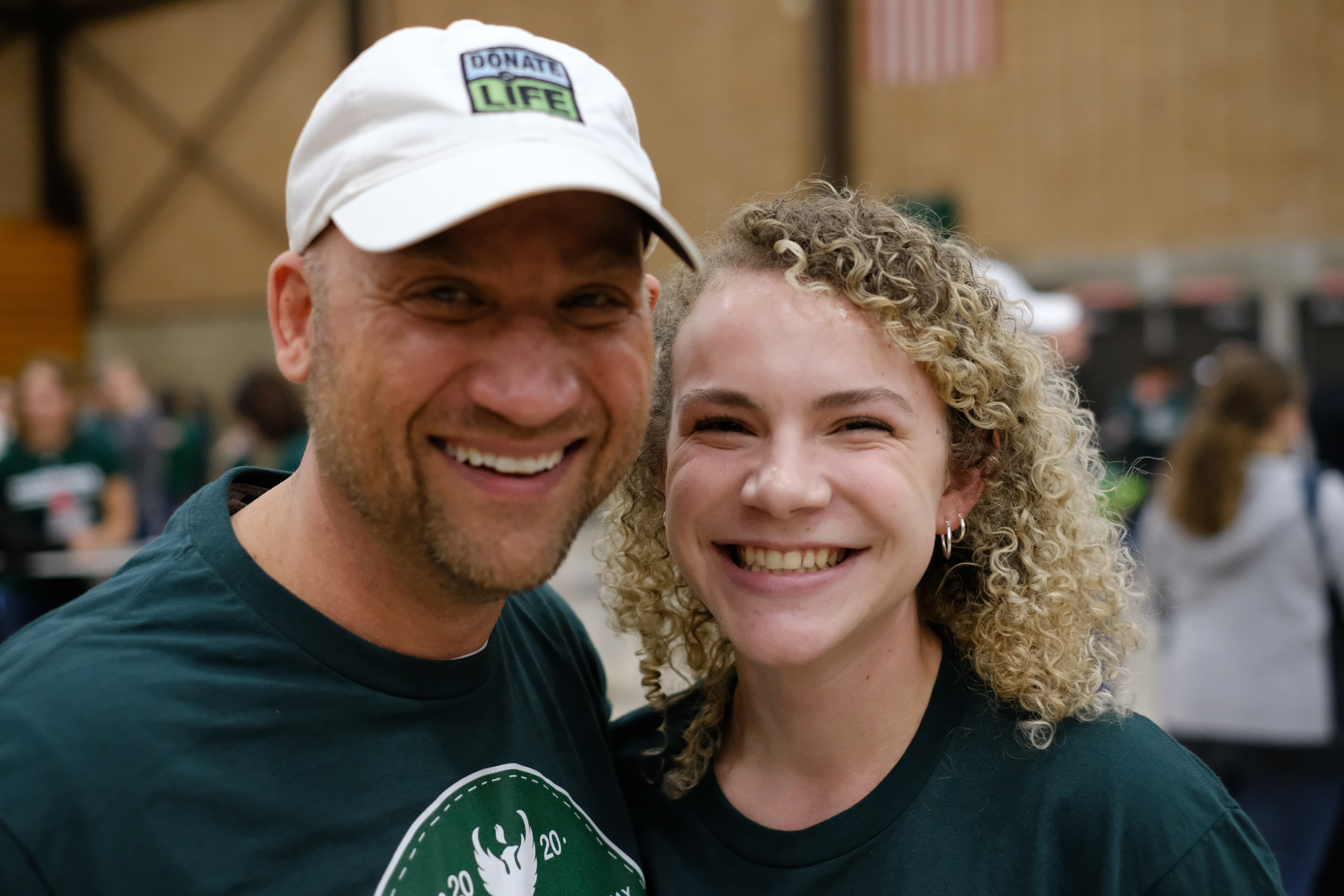 A student and their family member smile at the camera while attending the annual Krash the Kresh event.