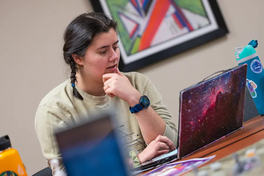 Student using laptop at DnD Game Day