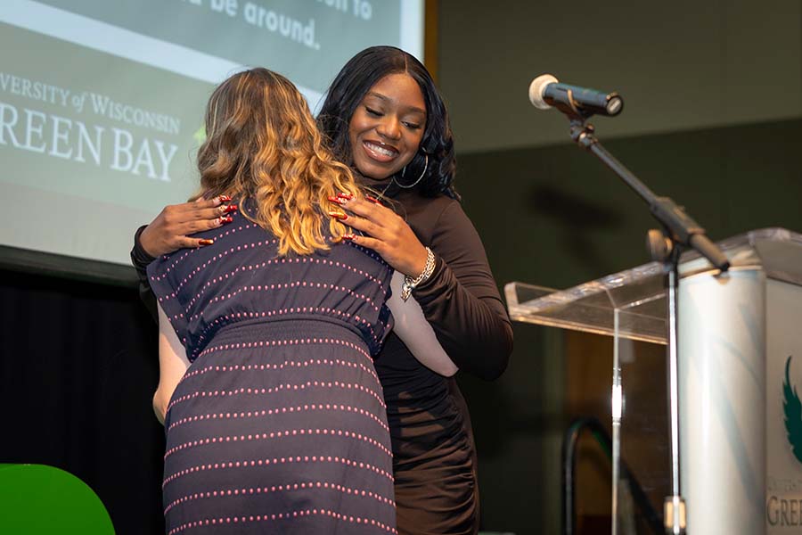 student on stage during GEAR UP Rising Phoenix celebration