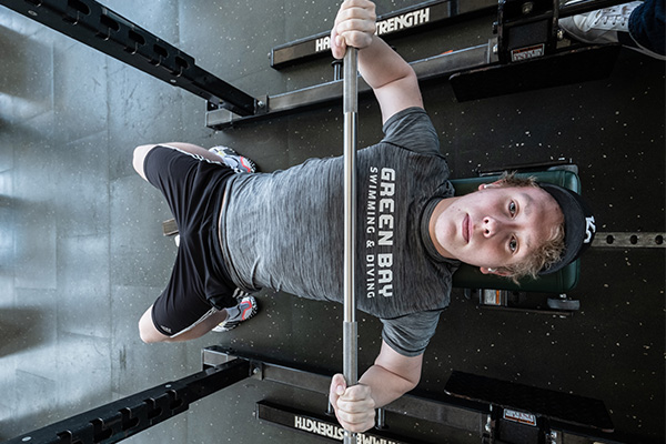 Student using bench press freeweights