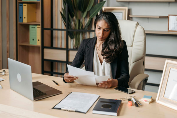 Female lawyer looks over paperwork