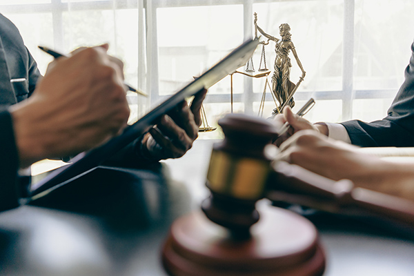 Closeup of hands of employees in law office