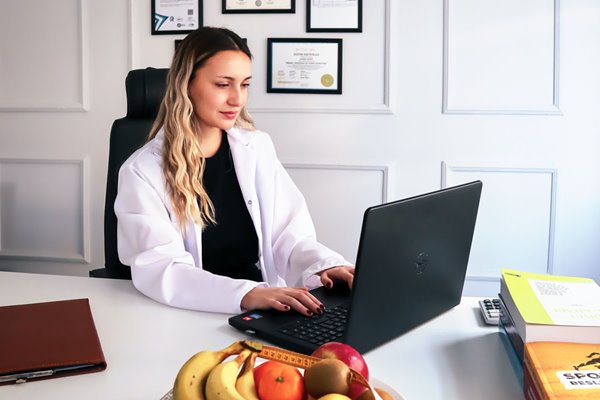 Professional works on laptop in office