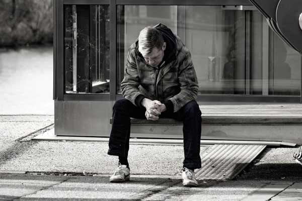 Male sitting on bench