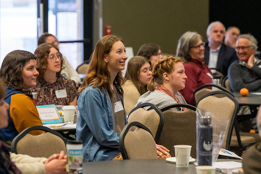 Students seated at symposium