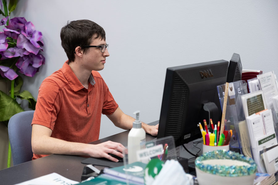 Student employee working at desk