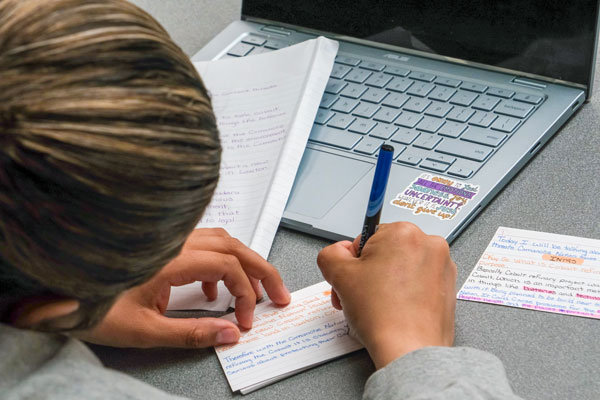 Student taking notes